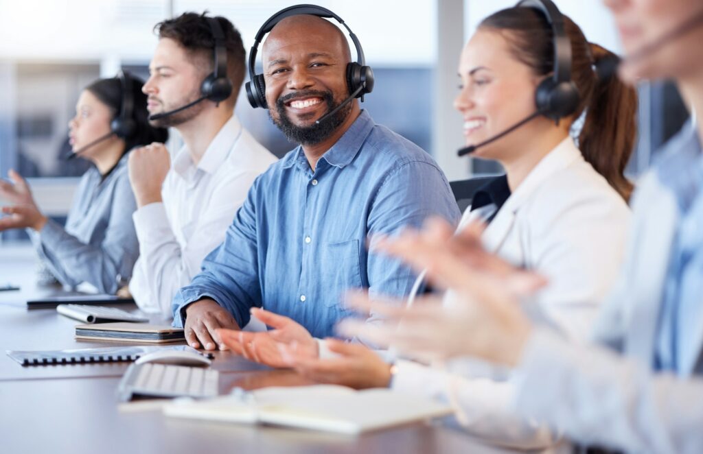 Contact us, call center or portrait of friendly black man in telecom communications company in help